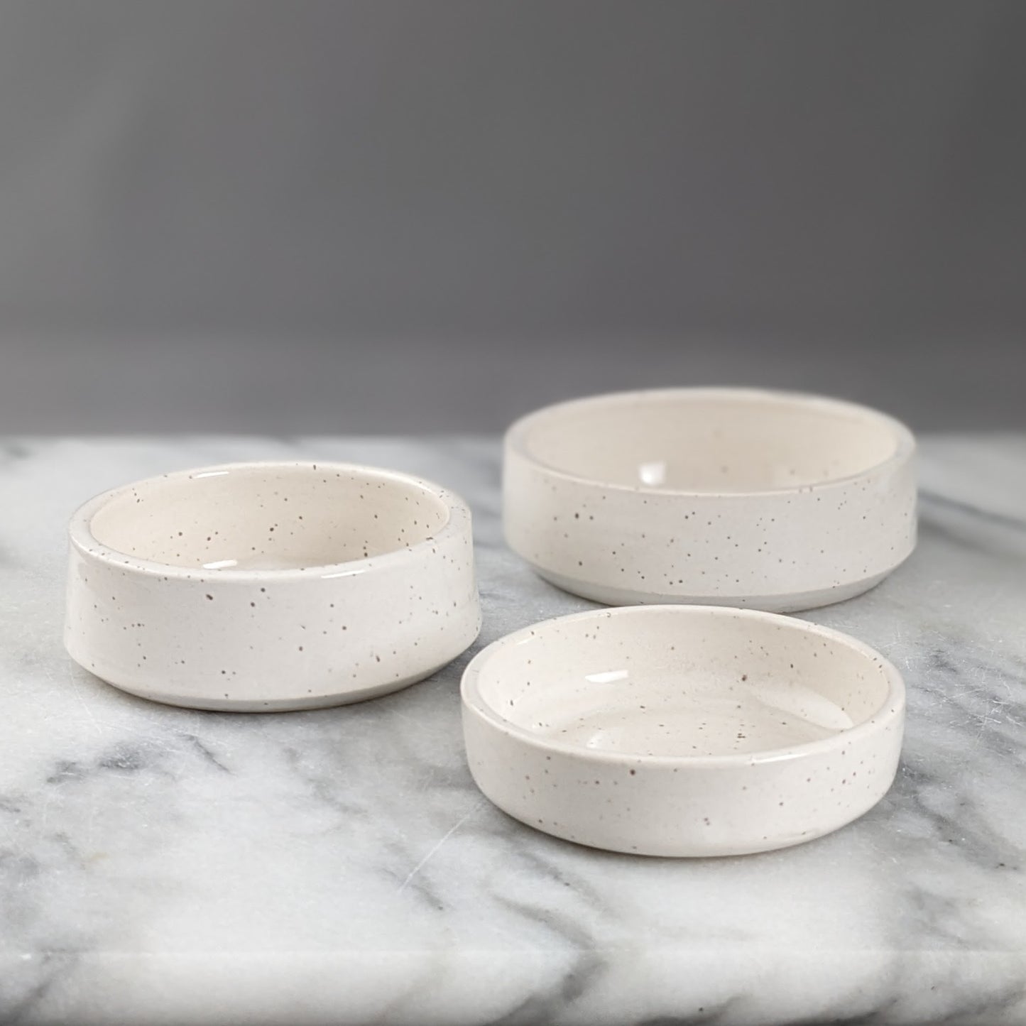 Set of Three White Speckled Dishes